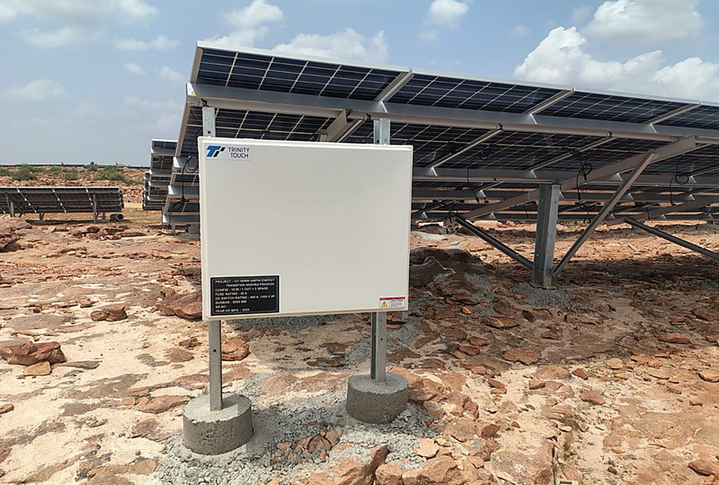 Commissioned solar array with equipment nameplate at the Owk plant